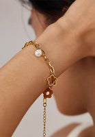 Rhea Flower and Pearl Charms Chain Bracelet in Gold